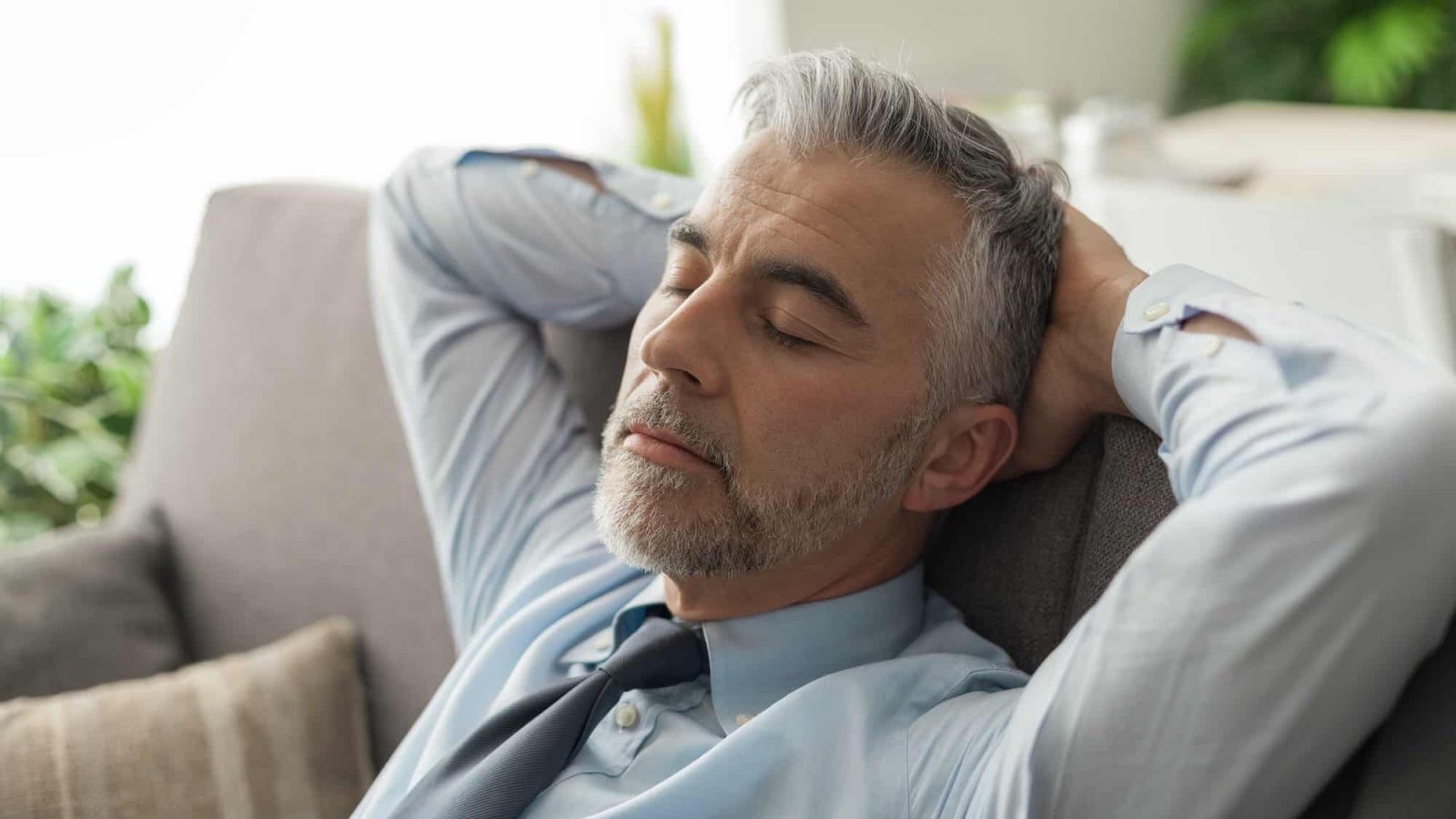 Businessman sleeping on the couch